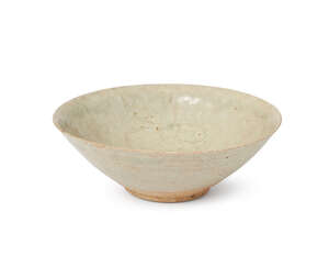 A Chinese porcelain bowl, Yuan dynasty, with thin translucent qingbai glaze and carved to the interior with three stylised floral motifs, 16.5cm diameter
