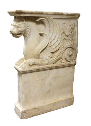 
	
		An Italian marble bench support, 20th century, carved with a griffin above a fluted base,...