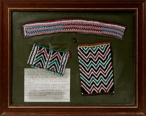 Three pieces of Zulu beadwork, c.1870s, framed and glazed on green leather backdrop with...