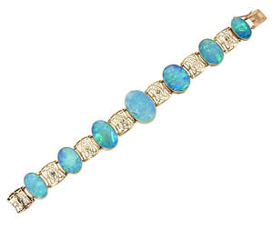 
	
		A late 19th early 20th century gold and black opal bracelet, composed of seven graduated...