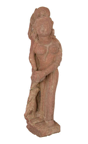 
	
		A red sandstone figure of an attendant, Central India, 12th century, carved with the...