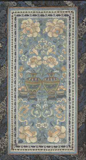 
	
		A Chinese silk embroidered sleeve, late 19th century, decorated with vases of flowers,...