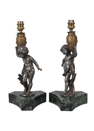 
	
		A pair of French gilt and silvered metal table lamps, 20th century, in the form of naked...