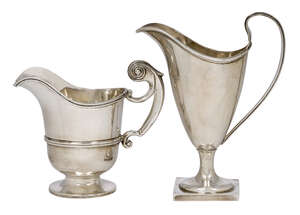 
	
		Two silver cream jugs, one Chester, c.1896, Florence Warden, of helmet design and raised...
