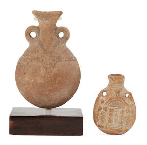 Two pottery flasks, including a vessel with two small handles, the swollen body with relief decoration of a pendant head of Hathor on both sides, a notched ban