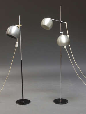 
	
		An aluminium two light floor lamp, c.1960s, with two adjustable domed shades, 141cm high,...