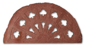 A Mughal semi-lunar red sandstone jali screen, India,18th century, with clover leaf openwork...