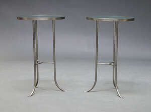 
	
		A pair of contemporary side tables, with circular glass tops on brushed steel rod tripod...
