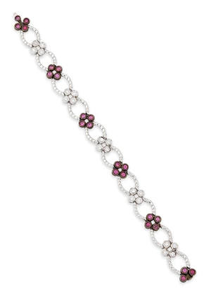 A ruby and diamond bracelet, designed as alternating ruby or brilliant-cut diamond quatrefoil...