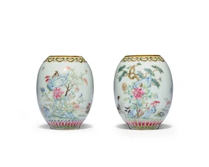 A pair of Chinese famille rose 'birds and flowers' oviform jars 
Republic period 
One enamelled with swallows by a rocky outcrop dotted with nandina berries,