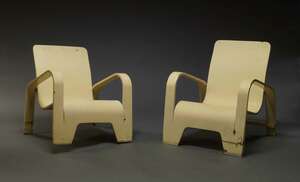 
	
		Han Pieck, a pair of white painted 'Lawo' chairs, designed c.1940s, with bent plywood...