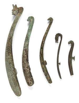  Five Chinese bronze belt hooks, Warring States - Han dynasty, one inlaid with gold, two inlaid...