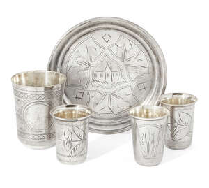 
	
		A small collection of Russian silver, comprising: three small silver shot cups, one Kiev,...