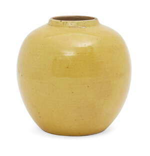 A Chinese porcelain monochrome jar, Jiaqing mark and of the period, covered in an egg-yolk yellow glaze, incised six-character mark to base, 13cm high