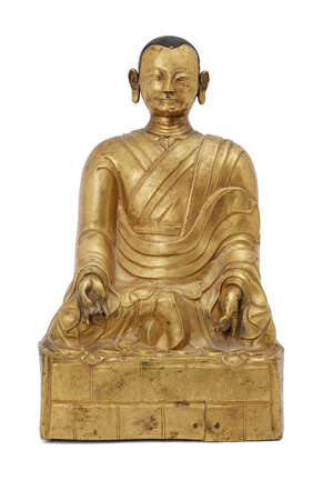
	
		A Chinese gilt-copper figure of a Lohan, late Qing dynasty, seated in dhyasana, wearing...