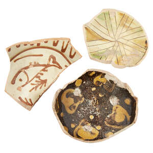 
	
		Three large Byzantine glazed pottery fragments, 10th-13th century, the first with a fish...