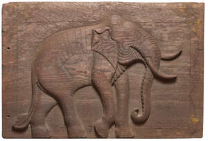 
	
		A carved wood panel in relief of an elephant, Rajasthan, India, 19th century, with traces...