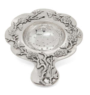 
	
		A Chinese silver petal-shaped tea strainer, Tuck Chang &Co., applied to the rim with...