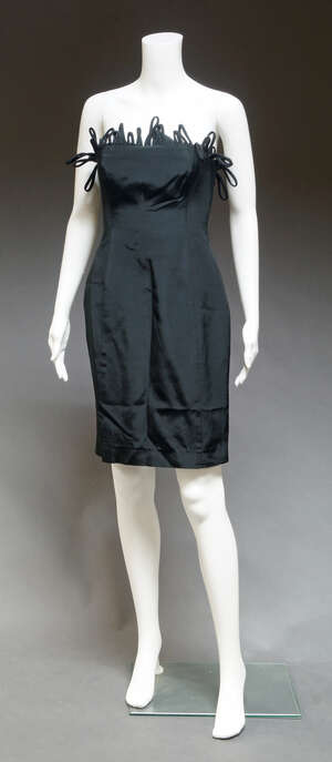 
	
		Ben de Lisi, a black viscose/cotton strapless sheath dress, with looped fringe to top,...