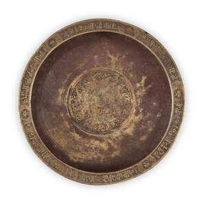 
	
		RTO A engraved Khorasan copper inlaid bronze dish, of deep form, the sides sloping...