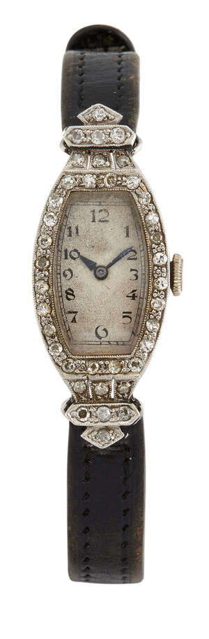 
	
		A lady's Art Deco platinum and diamond wristwatch, the tonneau shaped dial with Arabic...