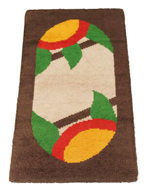 
	
		An Art Deco rug, possibly Irish
		c.1930
		With ovoid medallion and stylised floral...