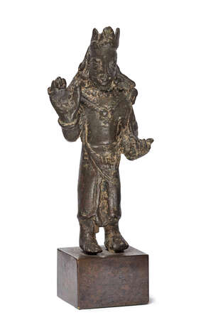 A bronze figure of Buddha Avalokitesvara crowned and bejewelled, Karkota Period, Kashmir, circa 800AD, depicted wearing a three-leaf triangular crown, on wood 