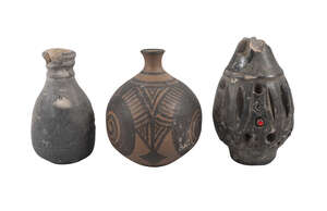 
	
		An ancient pottery flask, of bellied form, decorated with bands of pressed design and...