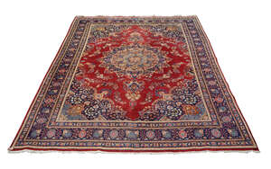 
	
		A Tabriz pattern carpet, mid/late 20th century, with medallion in red field, indigo...