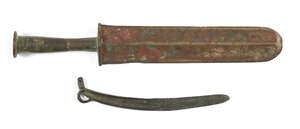 
	
		Two Chinese bronze knives, Warring States period and later, one with double-edged rounded...