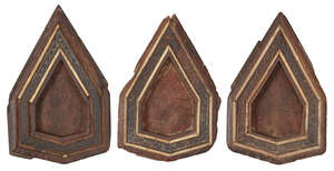 Three Mamluk bone-inlaid carved wood panels, Egypt, circa 14th century, each of polygonal form, inlaid with bone borders (some missing), the interior wood pane