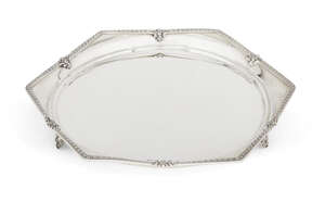 A hexagonal silver salver, Birmingham, c. 1934, Alexander Clark, with jubilee mark, the salver with circular base and six foliate patterned straight sides, eac