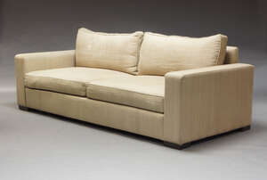 
	
		A large contemporary two seat sofa, of recent manufacture, upholstered in cream fabric...