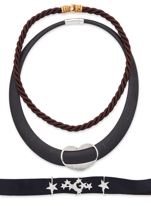 A group of three necklaces, comprising: a rubber necklace with a diamond set heart panel,...