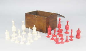 
	
		A bone and red stained bone chess set, 19th century, in a later box, the kings 10.5cm...