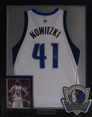 
	
		Dirk Nowitzki, a framed basket ball vest, for the Dallas Mavericks, signed to the back...