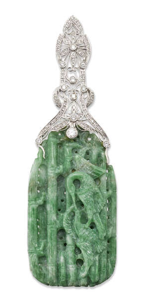 
	
		A jadeite jade and diamond pendant, the jade panel carved to depict two birds against a...