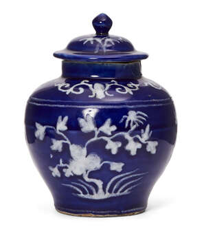 
	
		A Chinese slip-decorated blue-glazed jar and cover, Ming dynasty, decorated in white slip...