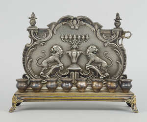 
	
		A silver plated Hannukah lamp, probably German or Austrian, late 19th century, the rococo...