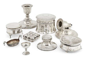 
	
		A group of small silver items comprising: a small circular trinket box raised on three...