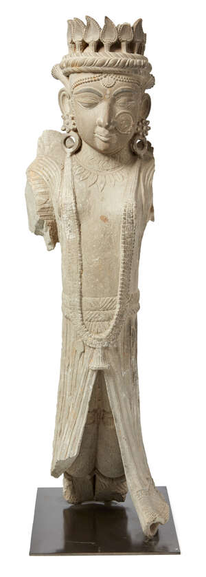 A stone statue of a winged angel, Murshidabad, India, 19th century, wearing draped robes, and elaborate necklace, earrings and diadem, the wings now missing, m