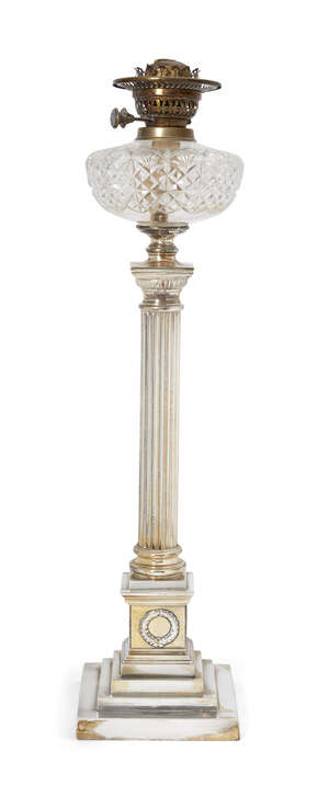 
	
		A Victorian silver-plated oil lamp, with brass burner fittings above a glass reservoir,...