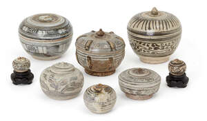 
	
		Eight Thai Sawankhalok circular boxes, 16th century, each painted in underglaze blue with...