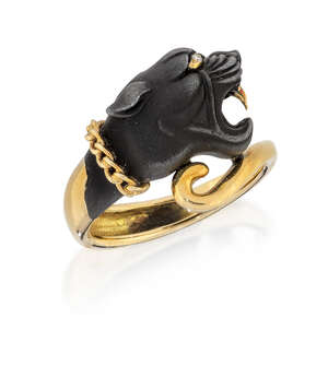 
	
		A diamond-set ring, of crossover design, the blackened front modelled as a panther head...