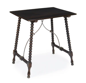 A Victorian ebonised beech trestle table, in the manner of William Morris, last quarter 19th century, the rectangular top with bent iron supports, with iron su