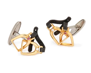 Carrera Y Carrera. A pair of gem-set cufflinks, of stirrup design, with ruby and diamond...