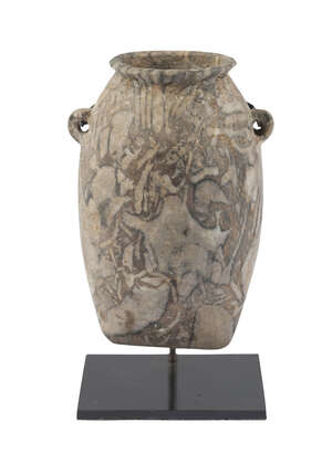 An Egyptian brecciated limestone sack vase, Predynastic Period, c. 3500 BC, 6.5cm. high
		 
		Provenance: Collection of Dr. J. M. Eisenberg, New York