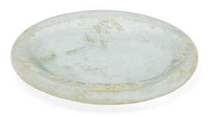 
	
		A Roman clear glass dish and a lid, 2nd-4th century AD, the first of deep form with heavy...