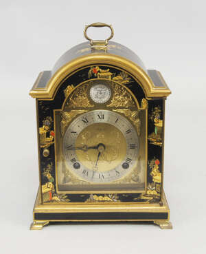 
	
		An Asprey clock, 20th century, the case of black lacquer decorated with Chinoiserie...