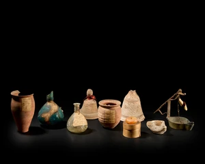 A miscellaneous group of antiquities, including a Roman pottery beaker with everted rim and flat...